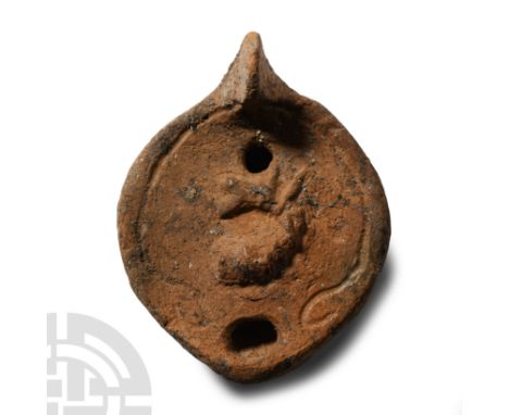 Circa 3rd-4th century A.D.. Mould made with a solid round unpierced handle, broad horizontal shoulder separated from the disc