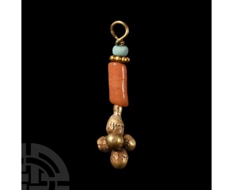 1st millennium B.C. Comprising a three-dimensional flower composed of gold spheres, supported by a slender stem with a turquo