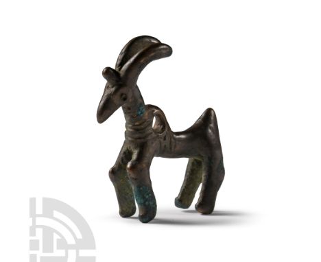 1000-700 B.C. Standing modelled in the round with head erect, curved horns, pierced at the shoulder. Cf. Engel, N. et al., Br