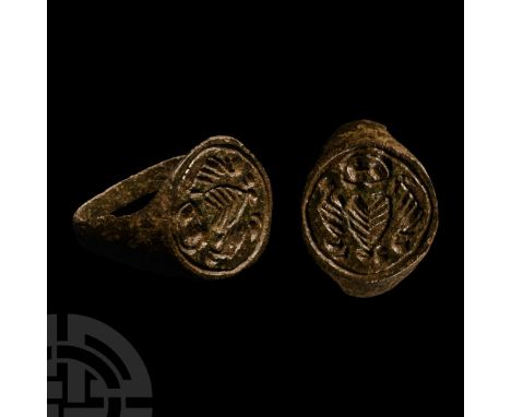 16th-17th century A.D.. With discoid bezel, incuse heart motif surrounded by scrolled foliage. Cf. Chadour, A.B., Rings. The 