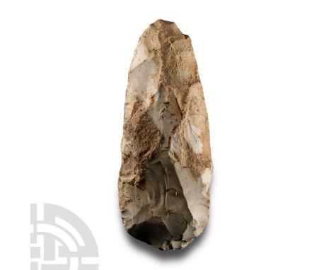 Neolithic Period, circa 4th-3rd millennium B.C. Thin-butted and trapezoidal with remains of cortex.  321 grams, 14.5 cm (5 3/