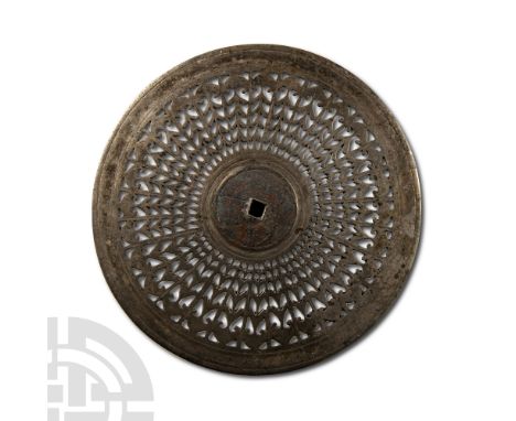 3rd century A.D.. With concentric lines of openwork ornament in lanceolate shapes, ending with crescent decorations. Cf. Bish