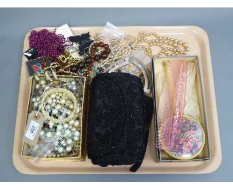 A tray of costume jewellery - bangle, evening bag, beads and necklaces etc 