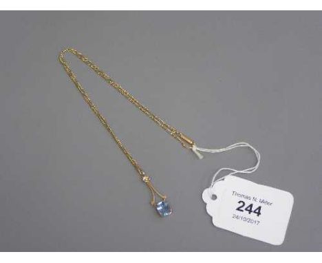 An Edwardian gold necklace set with a small pearl and aquamarine pendant