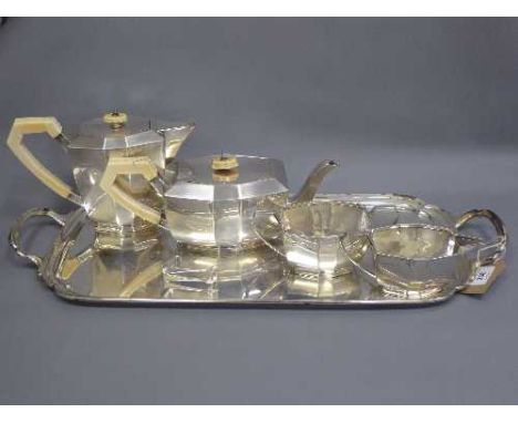 A silver Art Deco four piece tea service and tray, together with a small pair of silver sugar nips, 3503.7g, E Viners, Sheffi