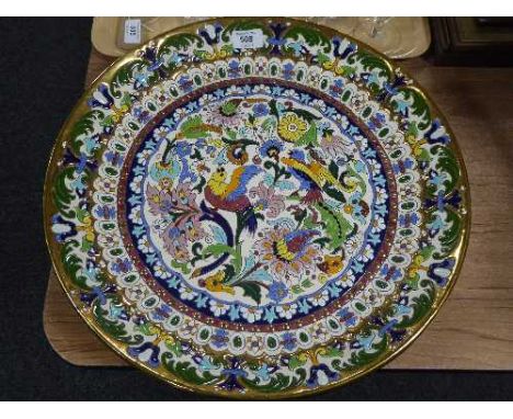 A large Spanish ceramic charger with bird and flower decoration 