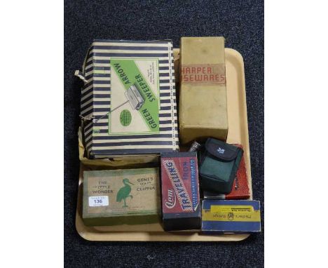 A tray containing a boxed vintage green arrow sweeper, boxed hair clippers, mincer, Gem travel iron etc