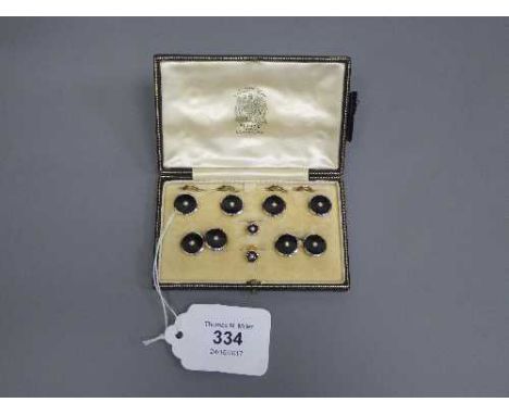 A boxed set of 18ct gold, platinum, agate and pearl set cufflinks and studs