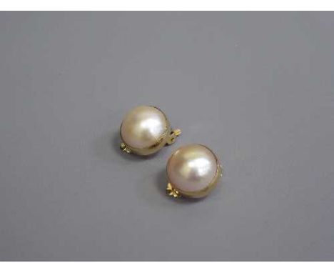 A pair of large mabe pearl earrings set in 18ct gold