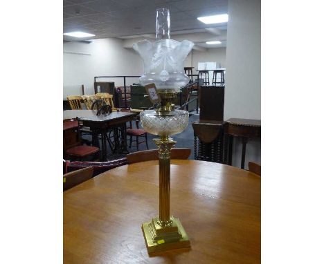 A brass Corinthian column Messenger's oil lamp with chimney and shade, retailed by Harrods