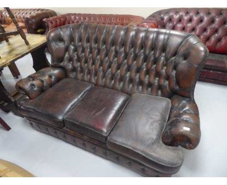 A re-upholstery project - a brown leather three seater Chesterfield (one odd cushion)
