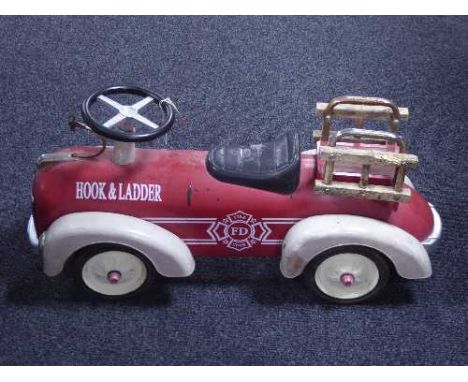 A child's hook and ladder fire department tin plate car 