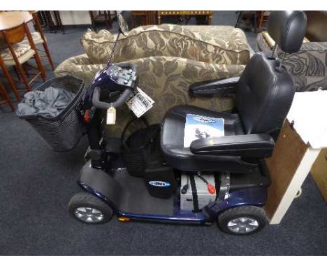 A Electro Motion Super Glide disability cart with keys, charger, manual etc