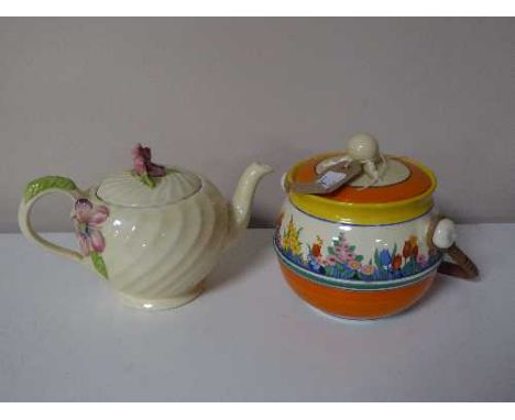 A Clarice Cliff lidded biscuit barrel and a Clarice Cliff teapot (2) 