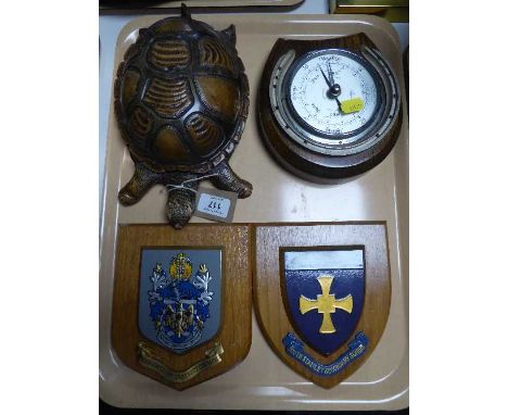 An oak horseshoe barometer with silvered dial, two military plaques and a carved wooden wind-up tortoise