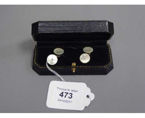A pair of gold and diamond set mother of pearl cufflinks