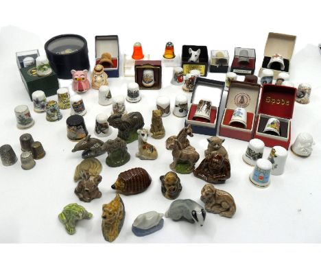 An interesting collection of thimbles including the Pink Panther and Inspector Clouseau, along with 2 Caithness thimbles and 