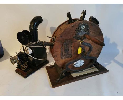 An early 20th century 'Kents' knife cleaner together with an early Cine projector. (2)