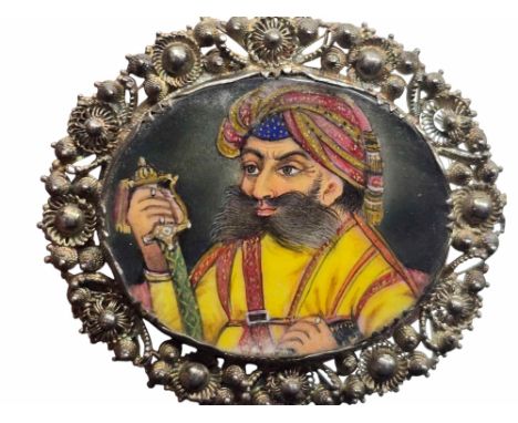 A miniature portrait brooch. Believed to be a portrait of Krishnaraja Wodeyar III (1794 -1868) The painting highlighted in gi