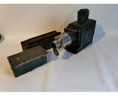 A magic lantern projector and two boxes of various slides. (1)