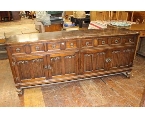Large vintage sideboard 4 x draws with 4 lower doors with linen fold detail to front H84cm x W193cm x D49Cm. This item will r