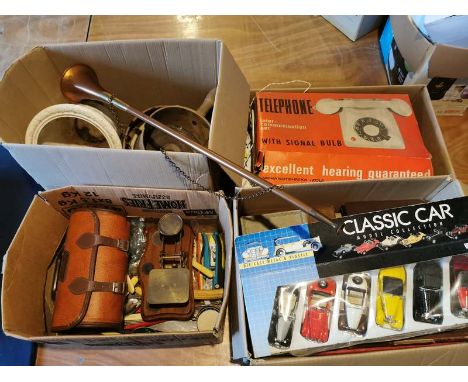 A large quantity of miscellaneous items to include; toy cars, cutlery, vintage science kits, copper horn, antique lace, telep