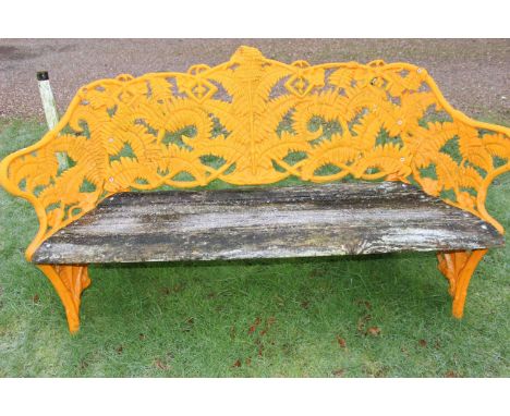 Coalbrookdale style cast iron garden bench finished in orange, wooden slats in overall good condition but may need a little w