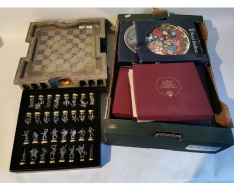 A Lord Of The Rings chess set and board together with a box of collectors plates. (1)