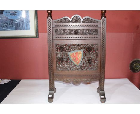 Carved wooden fire screen with Heraldic Shield Detail.
