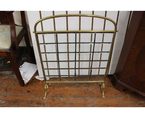 Brass and bevelled glass fire screen.