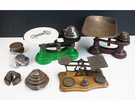 Three sets of vintage weighing scales with weights to include a cast iron set of butchers scales with white porcelain plate w