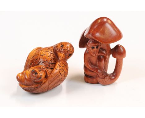 Two carved wood netsuke figures to include bird with baby monkey (signed) and a monkey sat in mushroom plants 