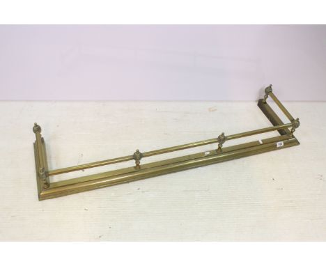 20th century brass fender fire surround together with small brass fire dogs and fireside set, approx. H 17cm, W 133cm, D 36cm