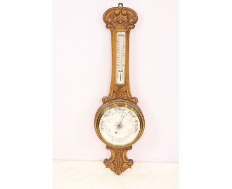 Chancellor &amp; Son, Dublin carved oak cased aneroid barometer, 84.5cm high