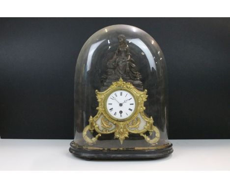 19th Century cast metal mantle clock with female figure and gil foliate details, the clock having a white enamelled face with