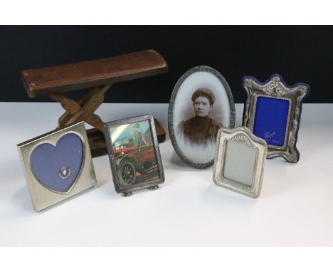 A collection of five silver plated easel back photograph frames 