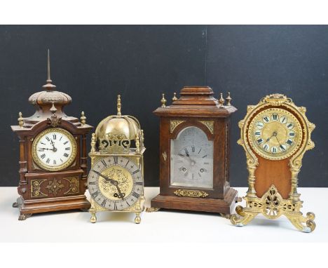 Four clocks to include Empire brass Lantern mantel clock together with a wooden carriage clock, wooden mantle clock with colu