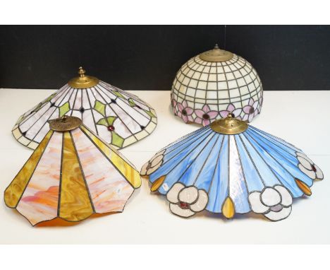 A Tiffany style table lamp together with three similar lampshades 