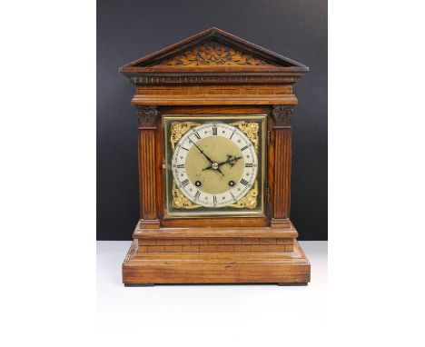 Late 19th century Winterhalder &amp; Hofmeier oak cased carved mantel clock of architectural form, the silver chapter ring wi