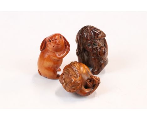 Three miniature wood netsuke figures to include monkey, Chinese dragon and a signed rabbit