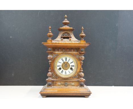 H.A.C 14 day strike mantel clock in carved wooden case with Roman numeral dial, No. 3080, made in Wurttemberg