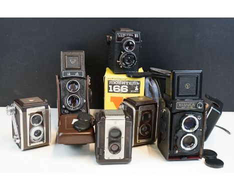 Six TLR cameras featuring a cased Yashica Mat-124 G, cased Seagull, boxed Lubitel 166 Lomo, Argus 75 and 2x Kodak examples.