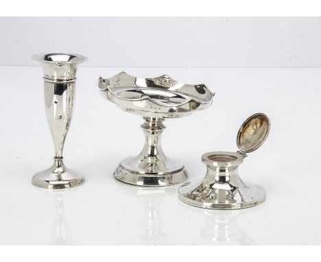 An Art Deco period silver filled capstan inkwell, together with a similar period bud vase and a damaged footed dish, snapped 