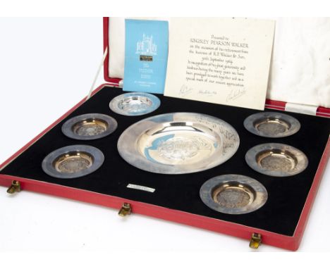 A 1960s cased set of seven silver Tudor dishes by The Alexander Clark Co, the large red fitted boxed containing one large and