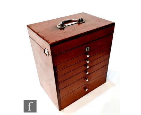 An early 20th Century mahogany dentistry cabinet for W.J.M Hale, the top opening to reveal a fitted interior of glass jars ab