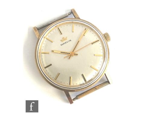 A gentleman's 9ct Marvin manual wrist watch, batons to a circular silvered dial, case diameter 34mm, engraved to case reverse