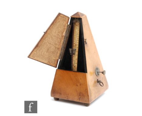 A Maezel walnut cased metronome. 