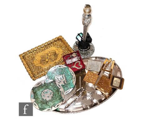 Various brass compacts, a button cleaner, an adjustable dress holder, two Peruvian dishes, a pressed brass dressing tray, a K