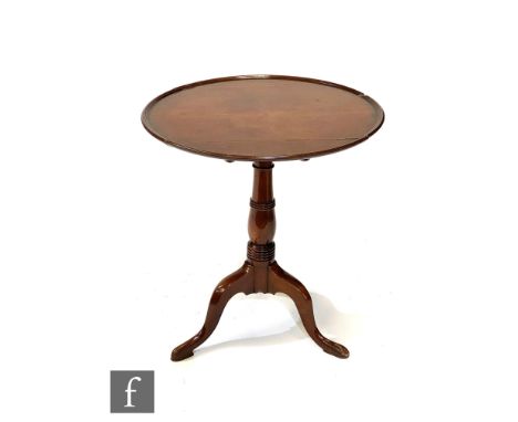 A 19th Century circular mahogany tilt top tripod occasional table on ring turned baluster pedestal and splayed legs, width 62