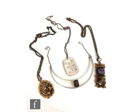 Two mid Century modern Finnish bronze pendants and chains, a Petti Sarpaneva Kelo example set with rough amethyst, length 6.5